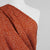 Palermo - Ginger Orange Dots Viscose Linen Woven Fabric Mannequin Close Up Image from Patternsandplains.com