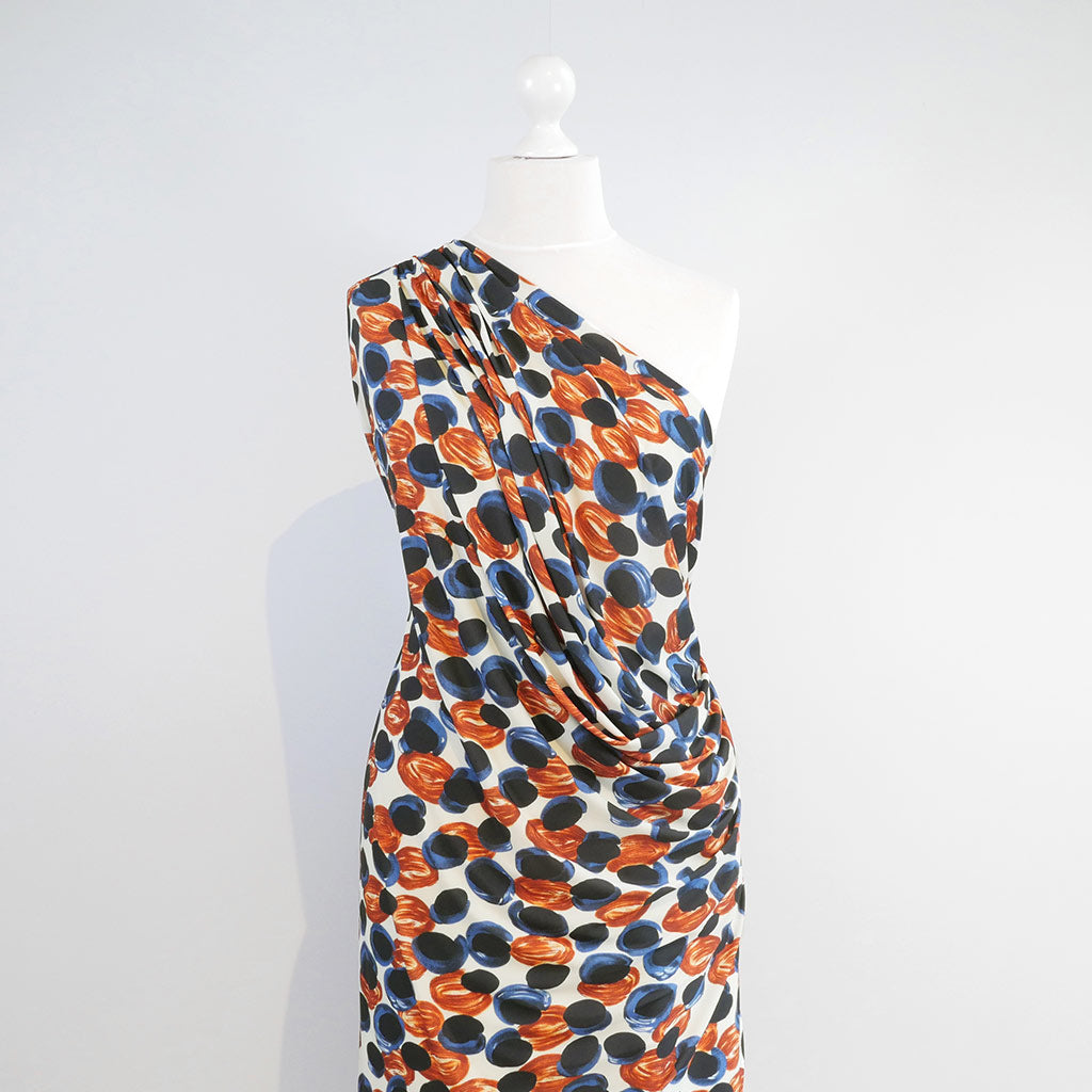 Portia - Blue and Orange Grapes Stretch Jersey Fabric from John Kaldor Mannequin Wide Image from Patternsandplains.com