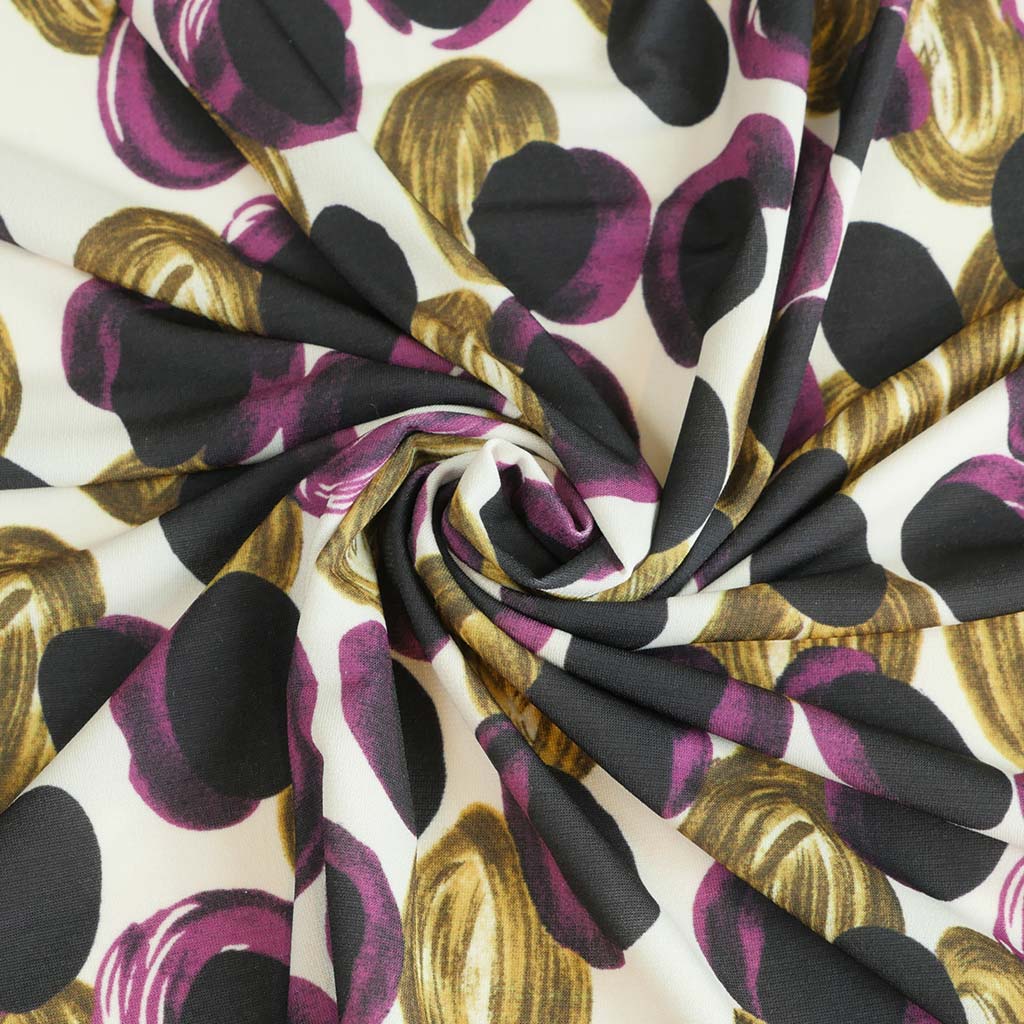 Portia - Purple and Lime Grapes Stretch Jersey Fabric from John Kaldor Detail Swirl Image from Patternsandplains.com