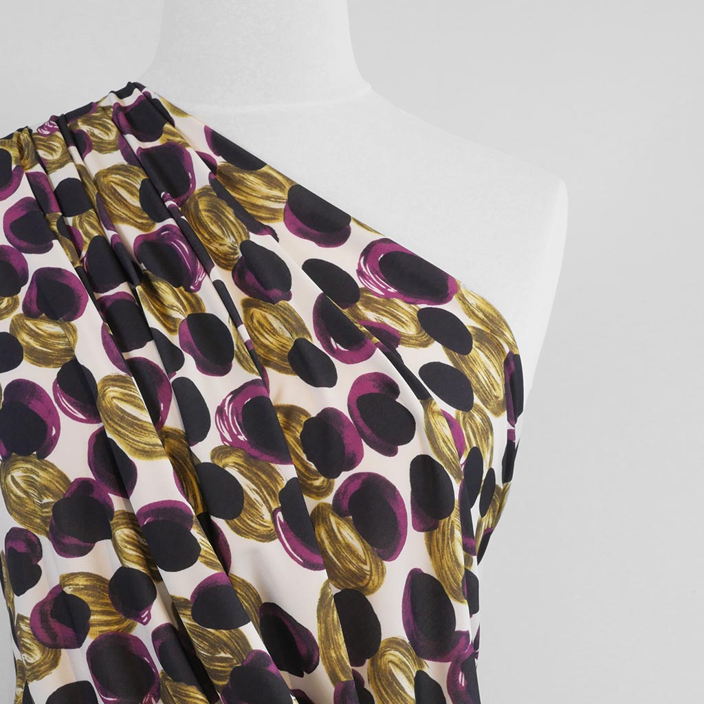 Portia - Purple and Lime Grapes Stretch Jersey Fabric from John Kaldor Mannequin Close Up Image from Patternsandplains.com