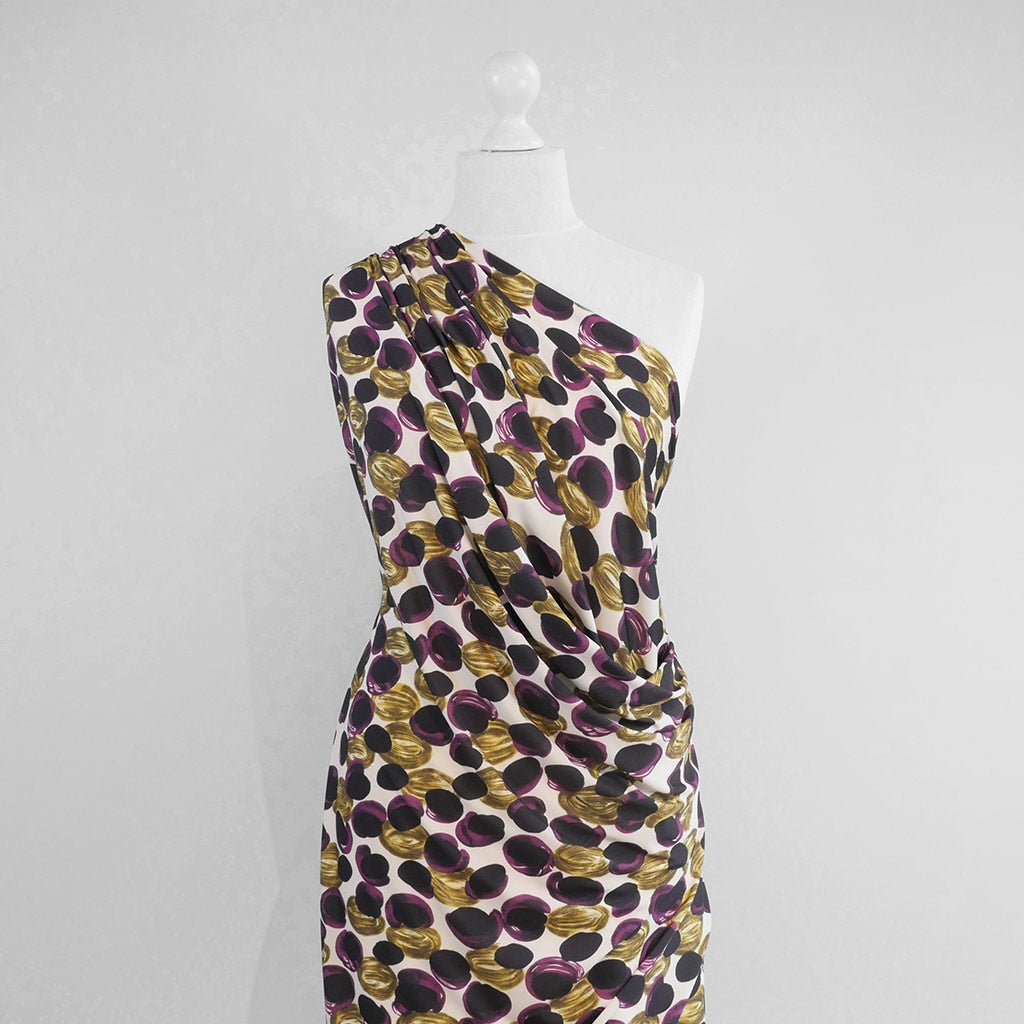 Portia - Purple and Lime Grapes Stretch Jersey Fabric from John Kaldor Mannequin Wide Image from Patternsandplains.com