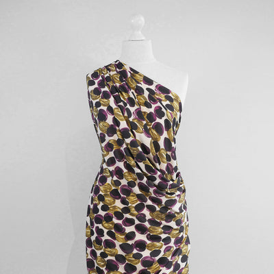 Portia - Purple and Lime Grapes Stretch Jersey Fabric from John Kaldor Mannequin Wide Image from Patternsandplains.com
