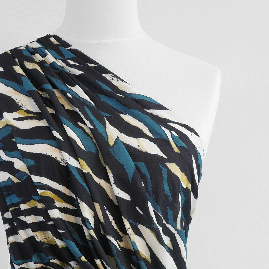 Portia - Teal and Lime Fracture Stretch Jersey Fabric from John Kaldor Mannequin Close Up Image from Patternsandplains.com