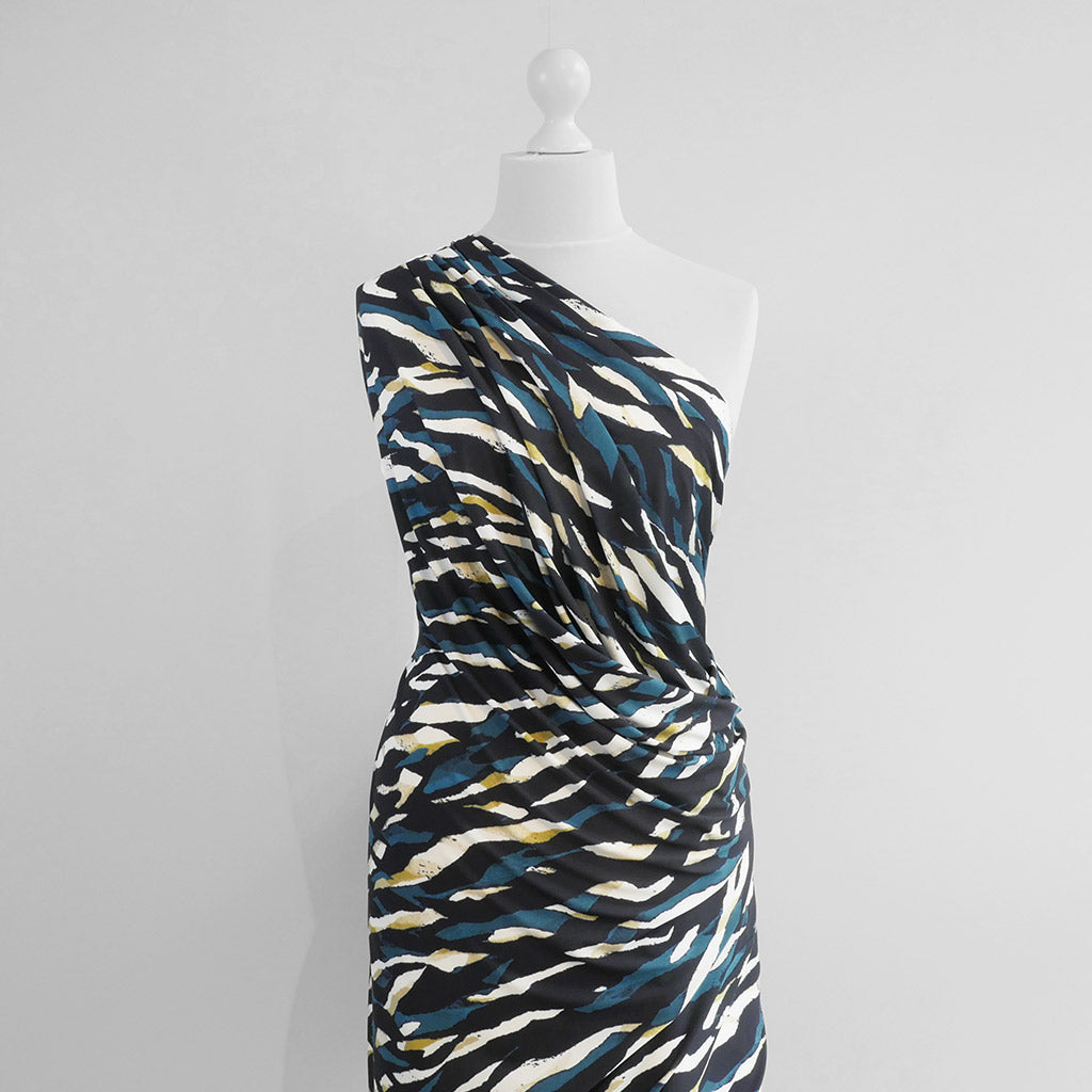 Portia - Teal and Lime Fracture Stretch Jersey Fabric from John Kaldor Mannequin Wide Image from Patternsandplains.com