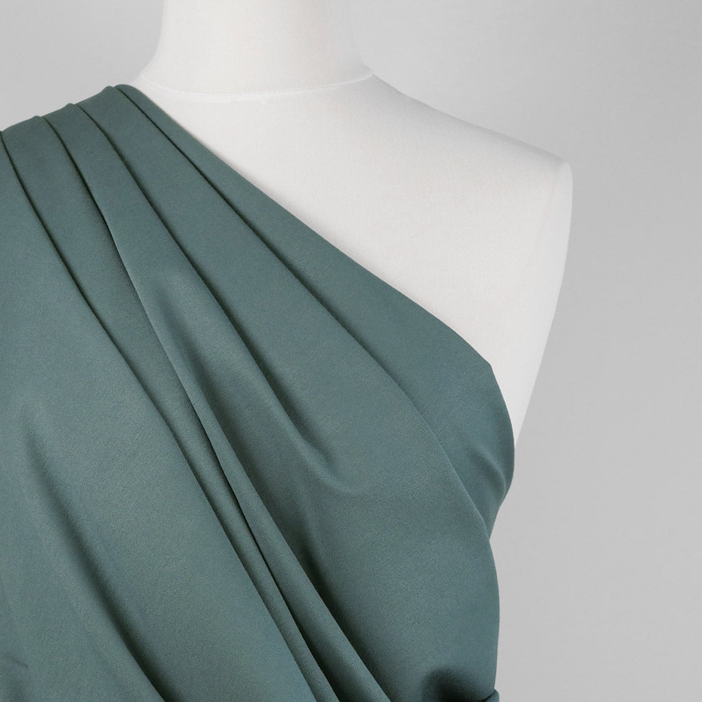 Rome - Steel Teal, Viscose Rich Heavy Ponte de Roma Stretch Fabric Mannequin Close Up Image from Patternsandplains.com