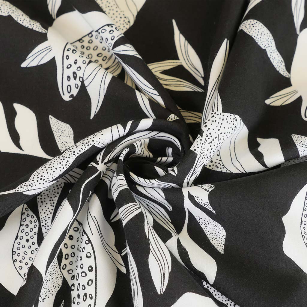 Sierra - Black Leaves Viscose Poplin Woven Fabric Detail Swirl Image from Patternsandplains.com
