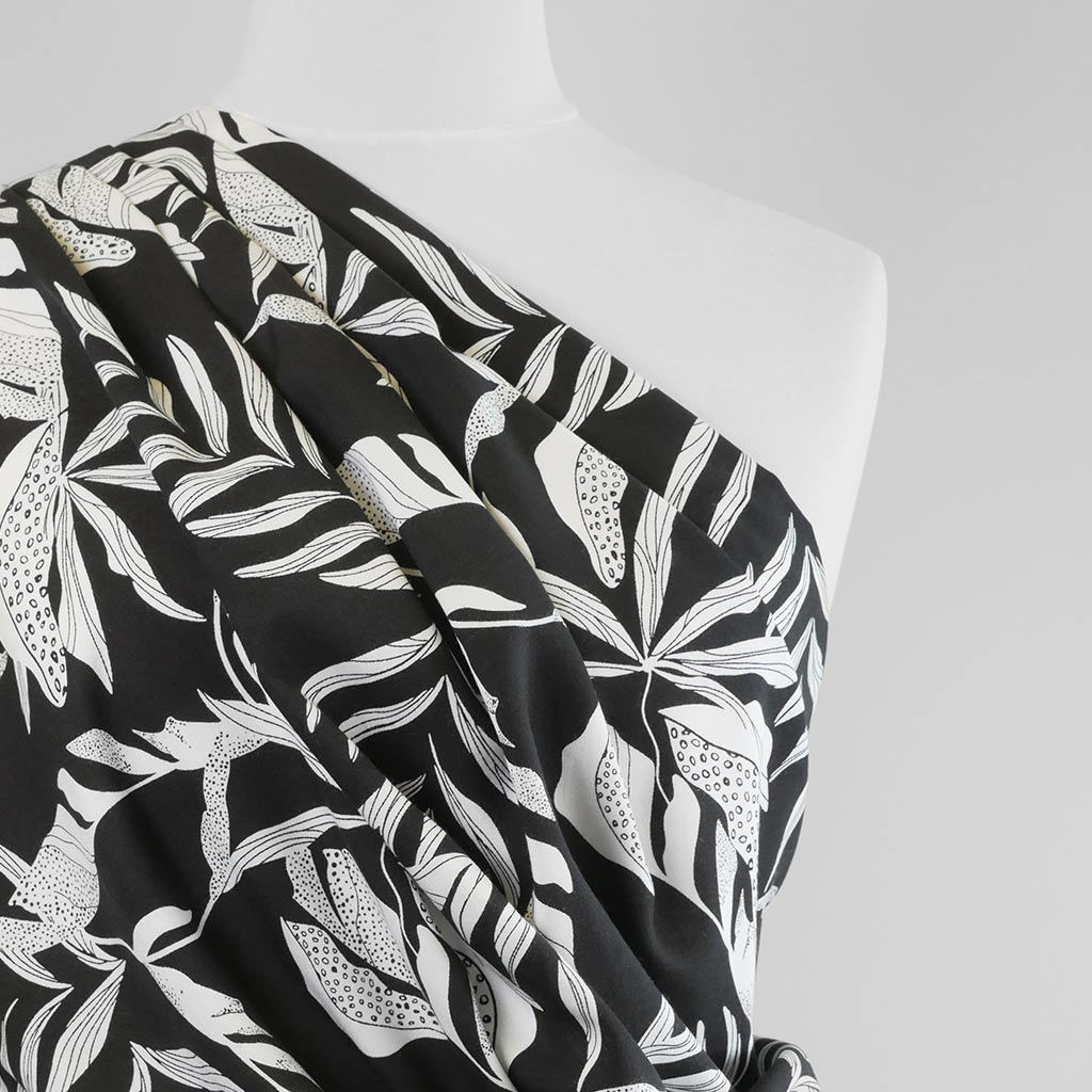 Sierra - Black Leaves Viscose Poplin Woven Fabric Mannequin Close Up Image from Patternsandplains.com