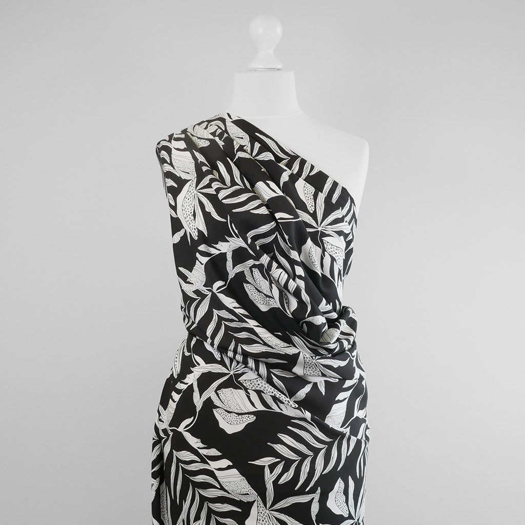 Sierra - Black Leaves Viscose Poplin Woven Fabric Mannequin Wide Image from Patternsandplains.com