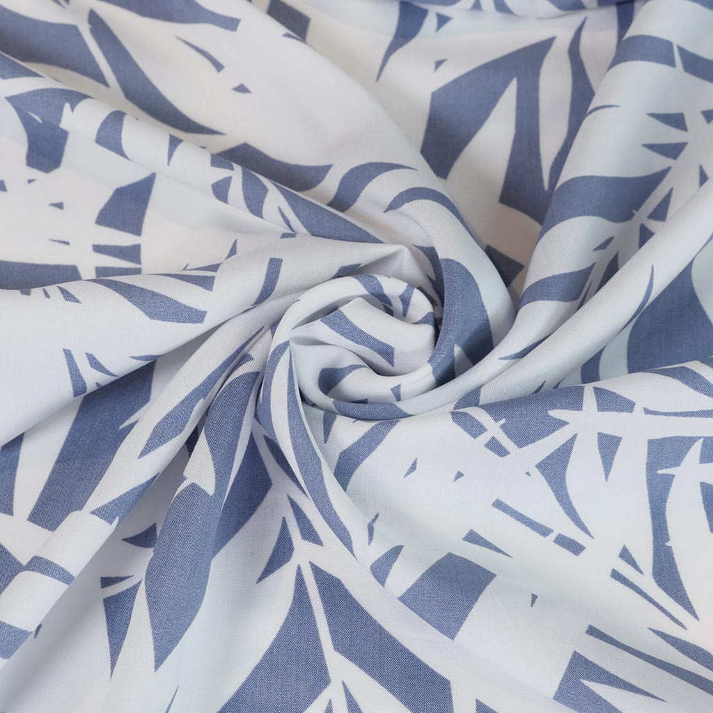 Sierra - Blue Palms Viscose Poplin Woven Fabric Detail Swirl Image from Patternsandplains.com