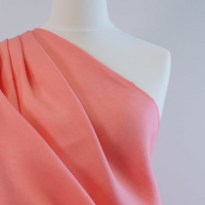 Skea Bright Coral 100% Linen Woven Fabric Mannequin Closeup Image From Patternsandplains.com