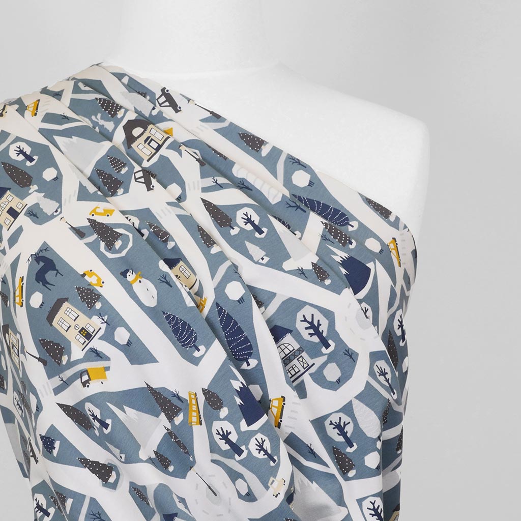 Arizona - Dusty Blue Winter Village, Single Jersey Cotton Elastane Print Fabric Mannequin Close Up Image from Patternsandplains.com