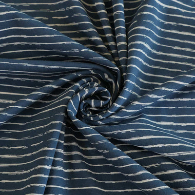 Arizona - Denim Blue Sketch Stripe, Single Jersey Cotton Elastane Print Fabric Detail Swirl Image from Patternsandplains.com