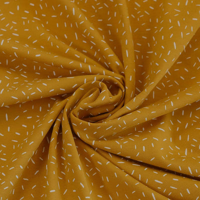 Arizona - Mustard Yellow Ticker Tape, Single Jersey Cotton Elastane Print Fabric Detail Swirl Image from Patternsandplains.com