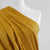 Arizona - Mustard Yellow Ticker Tape, Single Jersey Cotton Elastane Print Fabric Mannequin Close Up Image from Patternsandplains.com