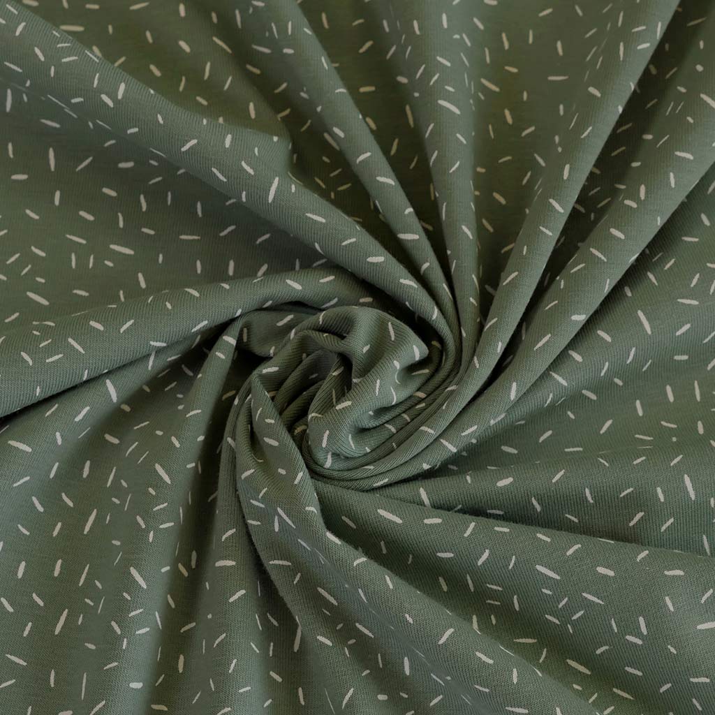 Arizona - Pistachio Green Ticker Tape, Single Jersey Cotton Elastane Print Fabric Detail Swirl Image from Patternsandplains.com