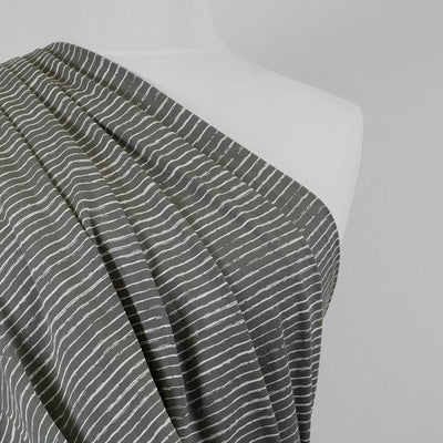 Arizona - Smoke Grey Sketch Stripe, Single Jersey Cotton Elastane Print Fabric Mannequin Close Up Image from Patternsandplains.com