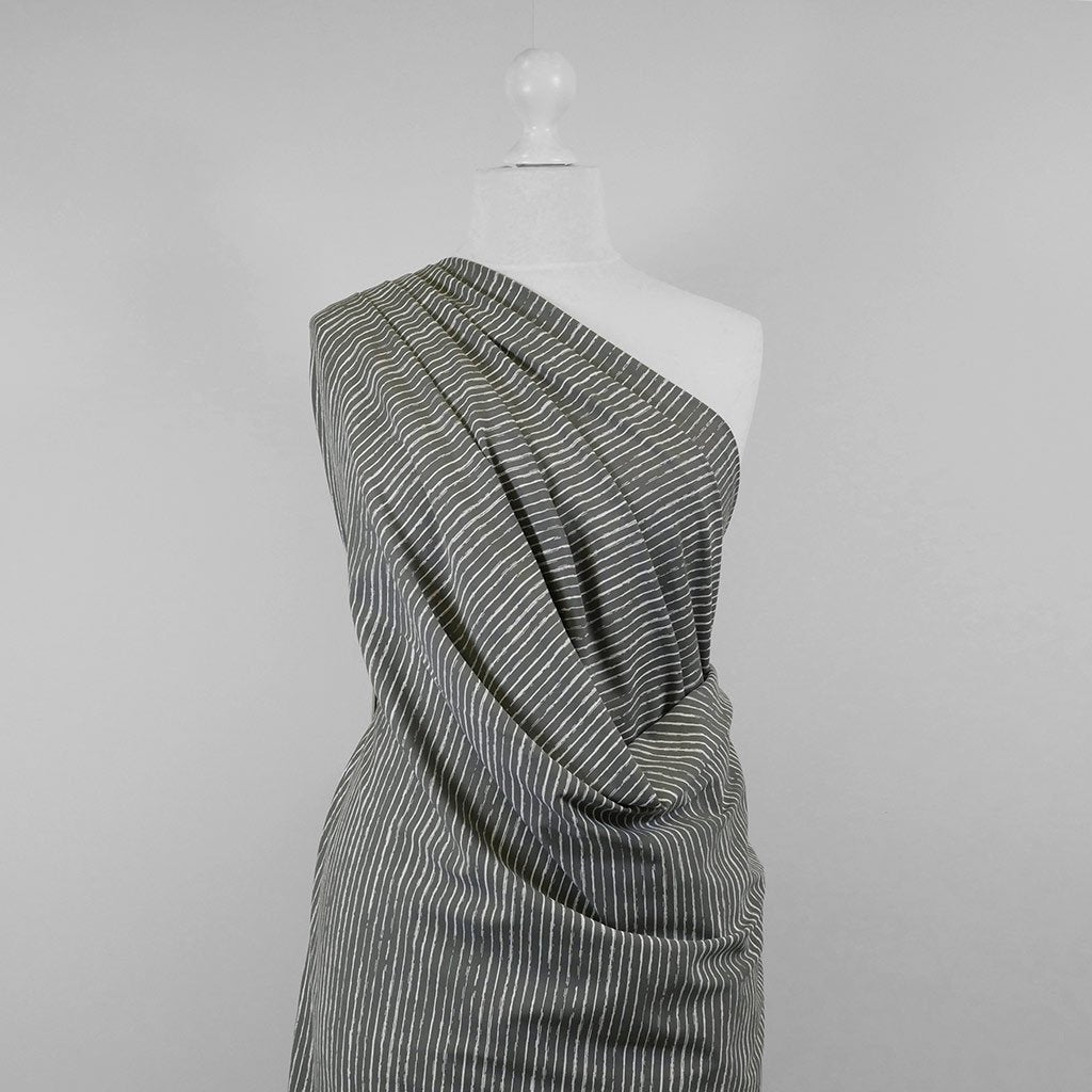Arizona - Smoke Grey Sketch Stripe, Single Jersey Cotton Elastane Print Fabric Mannequin Wide Image from Patternsandplains.com