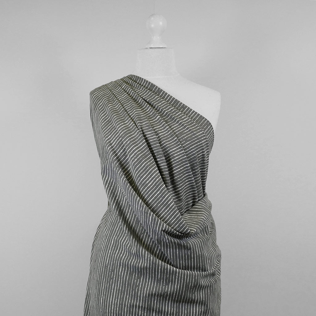 Arizona - Smoke Grey Sketch Stripe, Single Jersey Cotton Elastane Print Fabric Mannequin Wide Image from Patternsandplains.com