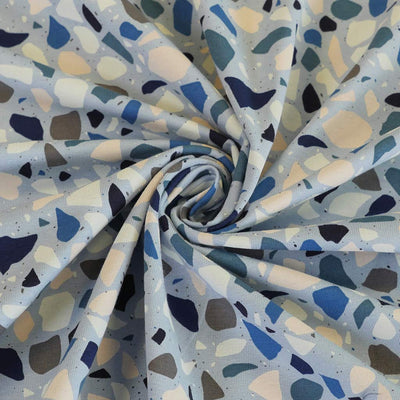 Arizona - Soft Blue Terrazzo Cotton Elastane Single Jersey Fabric Detail Swirl Image from Patternsandplains.com