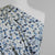 Arizona - Soft Blue Terrazzo Cotton Elastane Single Jersey Fabric Mannequin Close Up Image from Patternsandplains.com