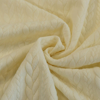 Bergen - Cream Aran Cables Double Jersey Blister Fabric Detail Swirl Image from Patternsandplains.com