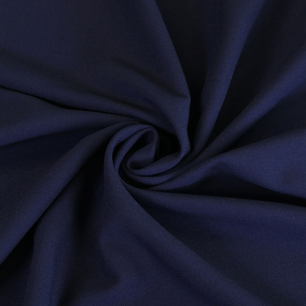 Bloomsbury - Light Navy Crepe Stretch Woven Suiting Fabric Detail Swirl Image from Patternsandplains.com