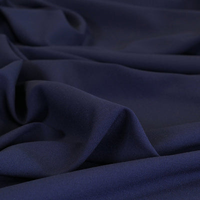 Bloomsbury - Light Navy Crepe Stretch Woven Suiting Fabric Feature Image from Patternsandplains.com