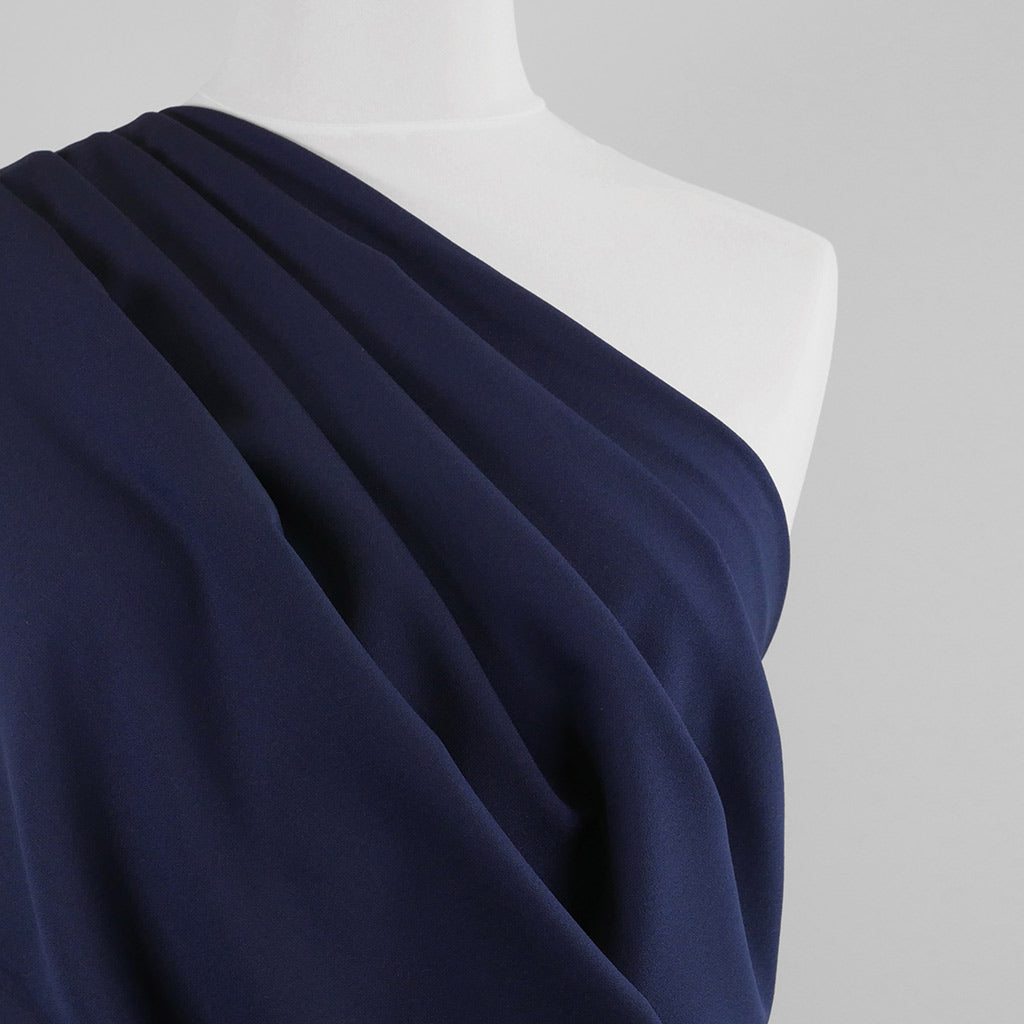 Bloomsbury - Light Navy Crepe Stretch Woven Suiting Fabric Mannequin Close Up Image from Patternsandplains.com