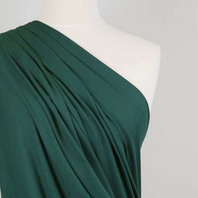 Camas - Pine Green Viscose Elastane Single Jersey Fabric Mannequin Close Up Image from Patternsandplains.com