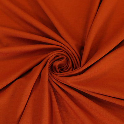 Camas - Pumpkin Viscose Elastane Single Jersey Fabric Detail Swirl Image from Patternsandplains.com