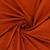 Camas - Pumpkin Viscose Elastane Single Jersey Fabric Detail Swirl Image from Patternsandplains.com