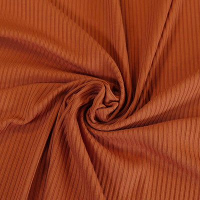 Fuji - Dark Amber Bamboo and Elastane Rib Knit Fabric Detail Swirl Image from Patternsandplains.com