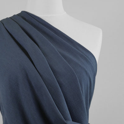 Liege - Denim Blue Viscose Linen Silky Noil Woven Fabric Mannequin Close Up Image from Patternsandplains.com