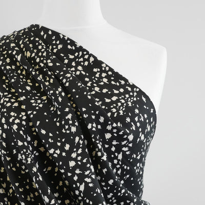 Linz- Black Animal Elements Viscose Woven Twill Fabric Mannequin Close Up Image from Patternsandplains.com