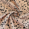 Linz- Shell Pink Animal Elements Viscose Woven Twill Fabric Detail Swirl Image from Patternsandplains.com