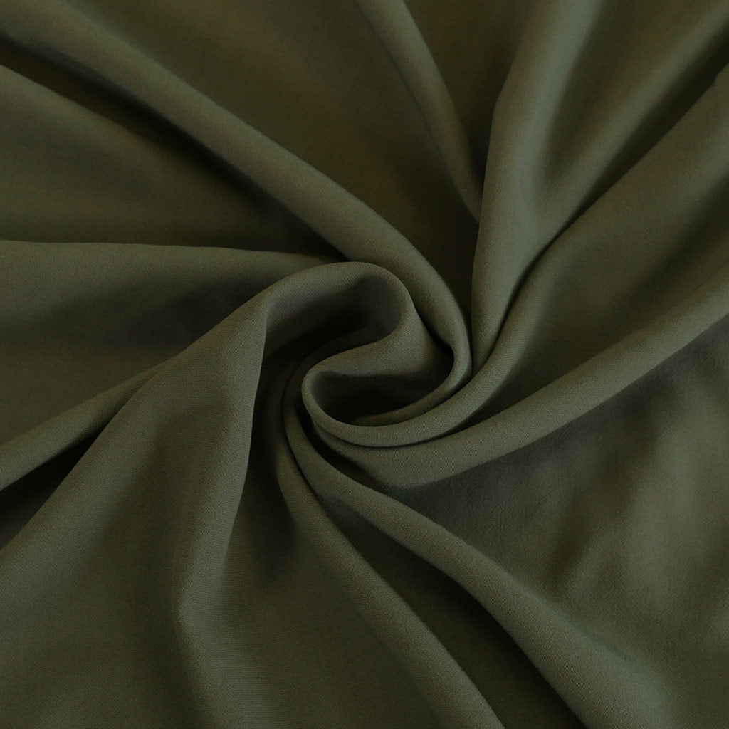 Madison - Sage Green Viscose Crepe Woven Fabric Detail Swirl Image from Patternsandplains.com