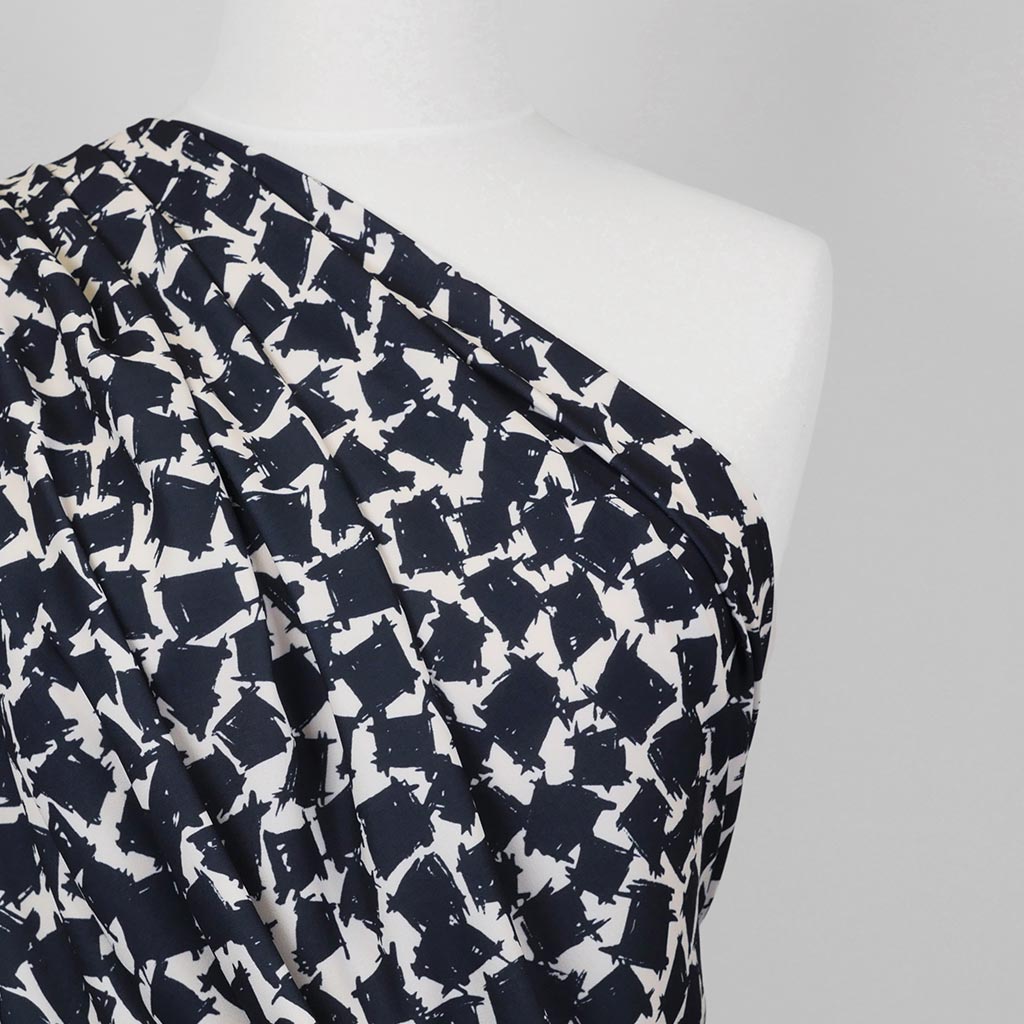 Madrid 4616 - Navy and Ivory Scribbled Squares Woven Crepe Fabric from John Kaldor Mannequin Close Up Image from Patternsandplains.com