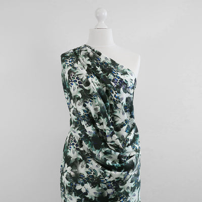 Malibu - Black Lilies Cotton Elastane Single Jersey Fabric Mannequin Wide Image from Patternsandplains.com