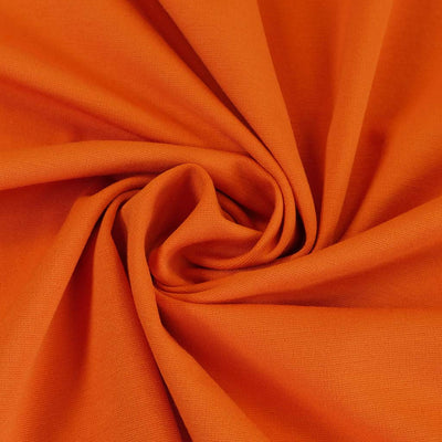 Milan - Pumpkin Orange Viscose Rich Ponte de Roma Fabric Detail Swirl Image from Patternsandplains.com