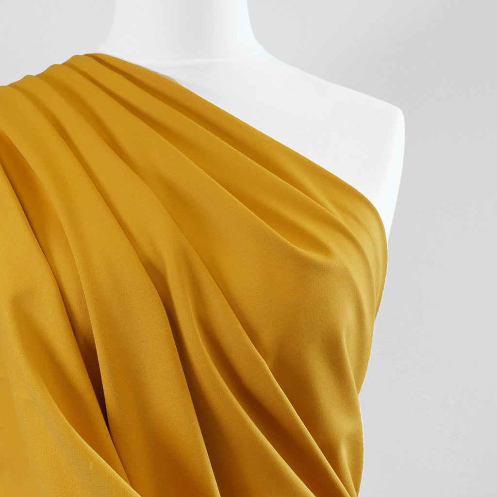 Milan - Saffron Yellow Viscose Rich Ponte de Roma Fabric Mannequin Close Up Image from Patternsandplains.com