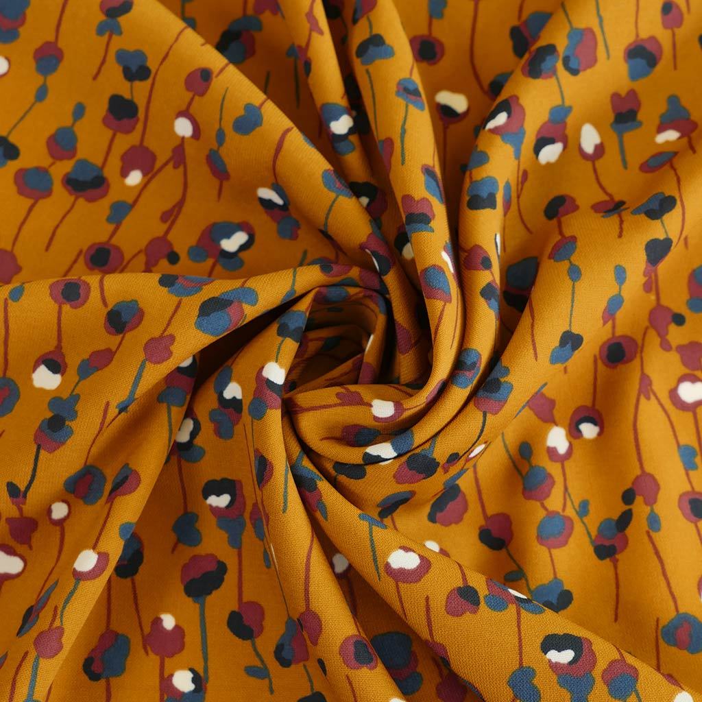 Monroe - Maize Yellow Seedlings Woven Crepe Fabric Detail Swirl Image from Patternsandplains.com