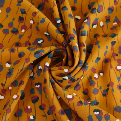 Monroe - Maize Yellow Seedlings Woven Crepe Fabric Detail Swirl Image from Patternsandplains.com