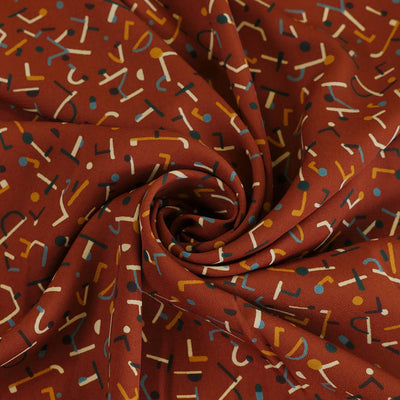 Monroe - Rust Jumbled Woven Crepe Fabric Detail Swirl Image from Patternsandplains.com
