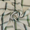 Nairn - Green Yarn Dyed Asymmetrical Plaid Woven Fabric Detail Swirl Image from Patternsandplains.com