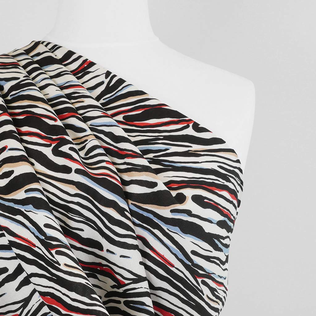 Palermo - Red Ebb & Flow Viscose Linen Woven Fabric Mannequin Close Up Image from Patternsandplains.com