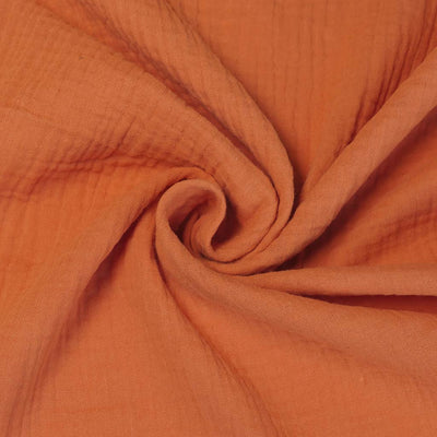 Seoni - Sunrise Orange Cotton Double Gauze Woven Fabric Detail Swirl Image from Patternsandplains.com