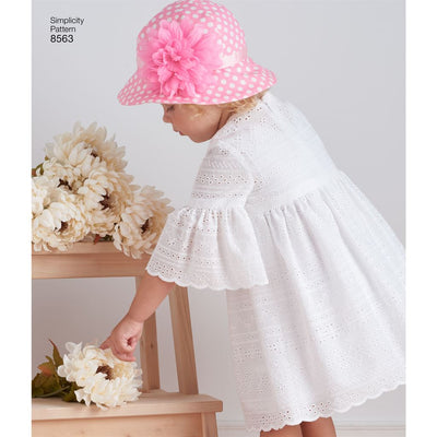 Simplicity Pattern 8563 Toddler Dresses and Hat Image 1 From Patternsandplains.com